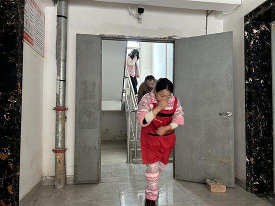 <em>黎川县</em>城市社区联合开展消防安全应急疏散演练活动